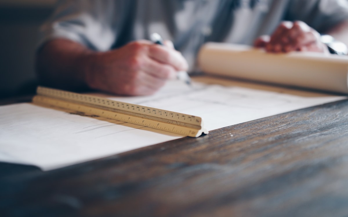 Engineer working on technical drawings